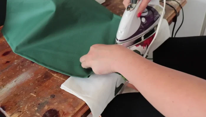 Create a small pocket along one side hem to accommodate the stabilizing rod from the original design.