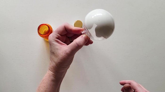 Swirl the paint around the inside until completely covered. Gently tap the sides to help the paint move if needed.