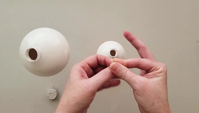 Once completely dry, reinsert the top hanger.