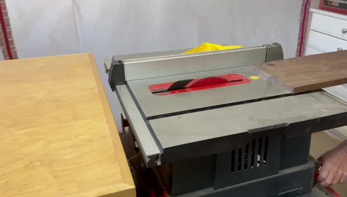 Resaw the board down the middle using the bandsaw to create two 3/8-inch thick pieces for the top and bottom.