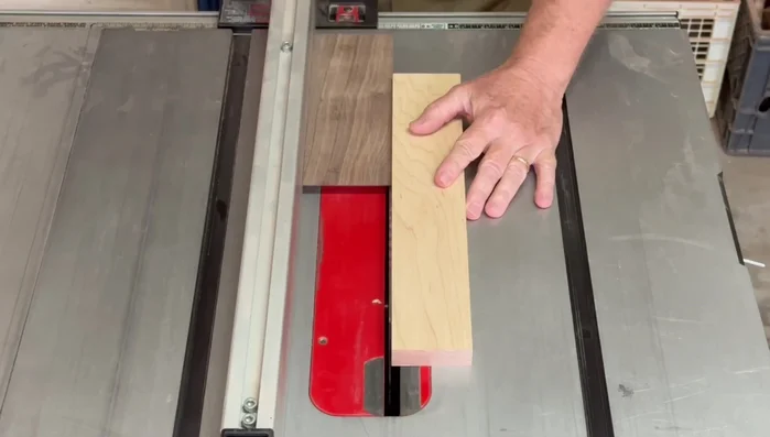 Cut one saw blade kerf off three sides of the box pieces (excluding the front and lid side).