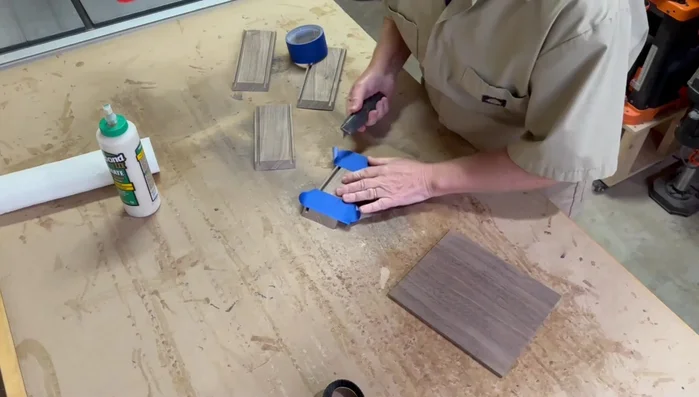 Glue up the box, using painter's tape to help with cleanup, and clamp securely.
