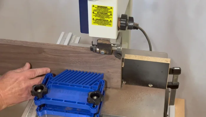 Resaw the board down the middle using the bandsaw to create two 3/8-inch thick pieces for the top and bottom.