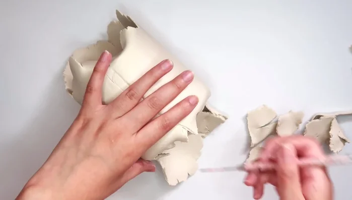 Smooth the clay with water.