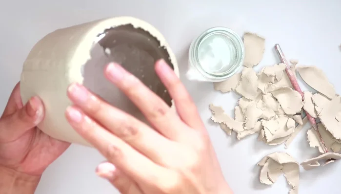 Smooth the clay with water.