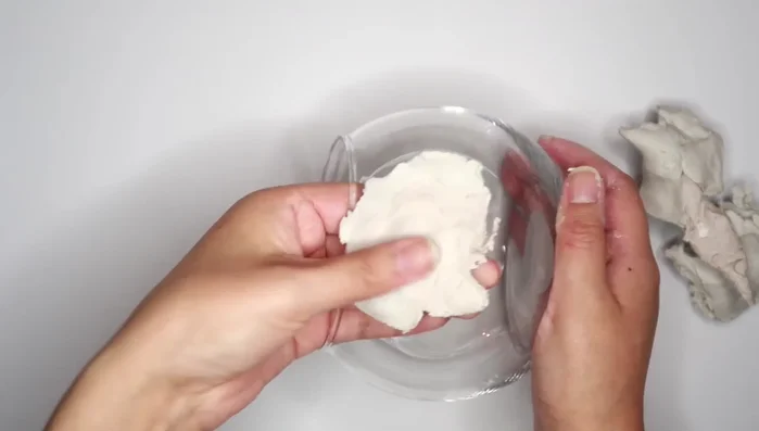Use water and your fingers (or a sponge/scraper tool) to smooth out the clay.