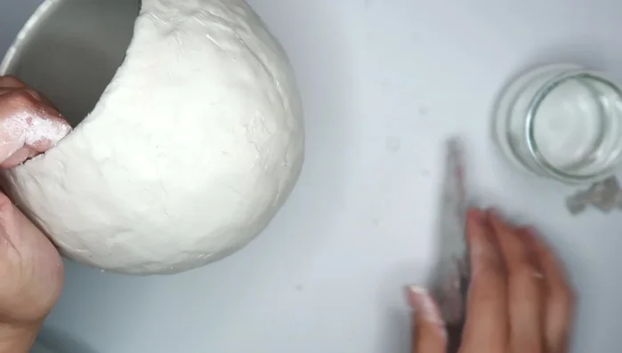 Use water and your fingers (or a sponge/scraper tool) to smooth out the clay.