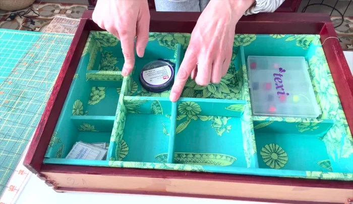 Glue dividers in place using a hot glue gun to secure the compartments.