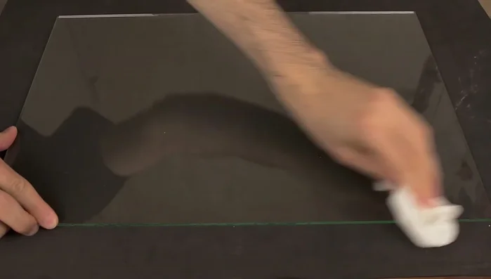 Clean all glass elements with acetone and paper towels to remove dust and grease. Use masking tape to prevent silicone overflow.