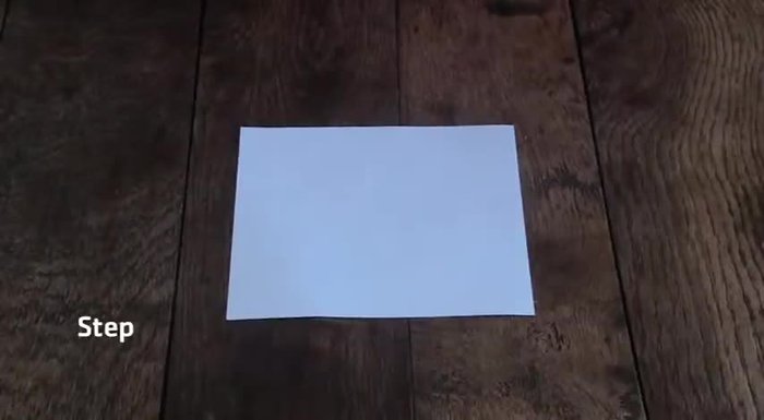 Repeat the fold along the other diagonal to create a smaller triangle.