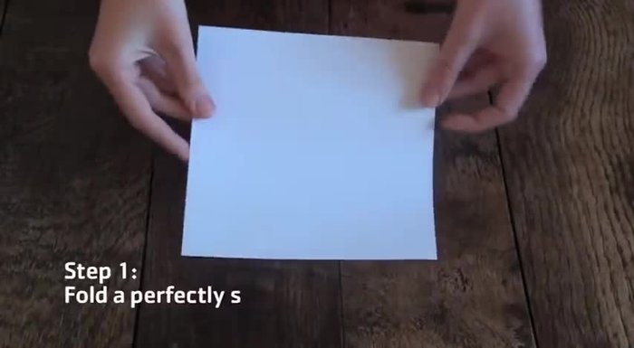 Repeat the fold along the other diagonal to create a smaller triangle.