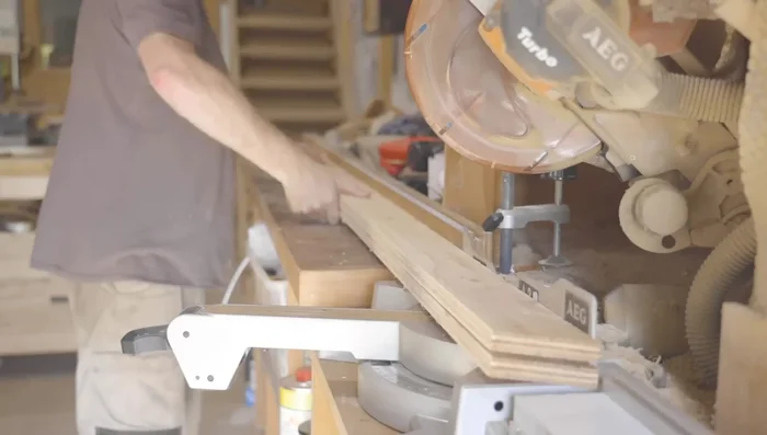 Cut plywood pieces to the calculated dimensions, accounting for the 15-degree angle at the top and bottom.