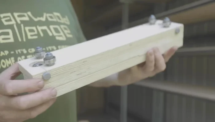 Build a carriage system (using plywood, bearings, and bolts) to allow the ladder to smoothly slide along the rail, addressing any potential binding issues.
