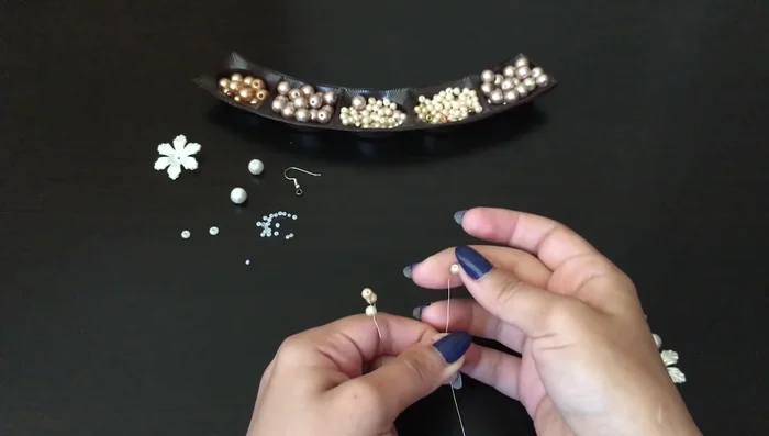 Add a branch with one pearl, twisting eight times.