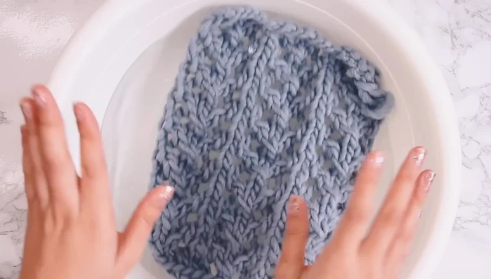 Block the scarf to open up the lace (submerge in room temperature water for 15 minutes, gently squeeze out excess water, roll in a towel, pin to dry flat).