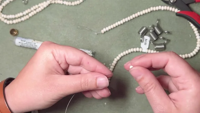 Adjust strand lengths by adding or removing beads until all strands match in length and pattern. 