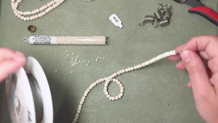 Adjust strand lengths by adding or removing beads until all strands match in length and pattern. 