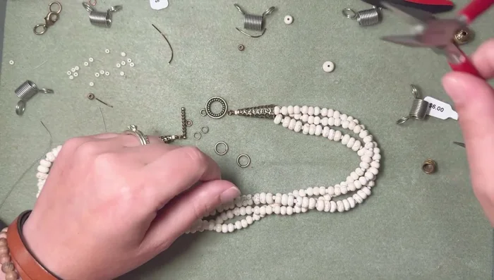 Attach the toggle clasp using jump rings. For a secure closure, use two small jump rings on the toggle bar itself, in addition to a larger jump ring on the necklace end. This ensures the toggle bar stays in place and that you're able to easily attach and detach the clasp.