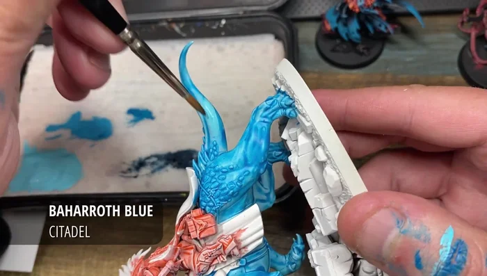 After drying (approx. 30 minutes), highlight and clean up the flesh areas using Baharoth Blue. Multiple coats may be needed for a smooth finish.