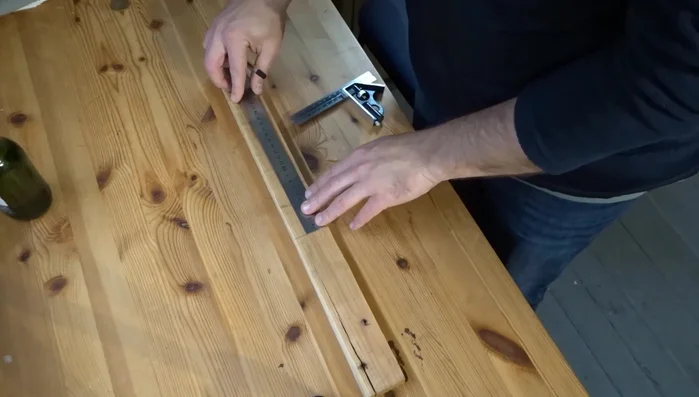 Drill a hole for the coin using a 30mm Forstner bit, matching the coin's diameter and thickness. Also, drill and countersink a hole in the center of the coin for a screw.