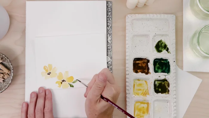 Mix green paint and paint organic leaf shapes, using one or two brushstrokes.