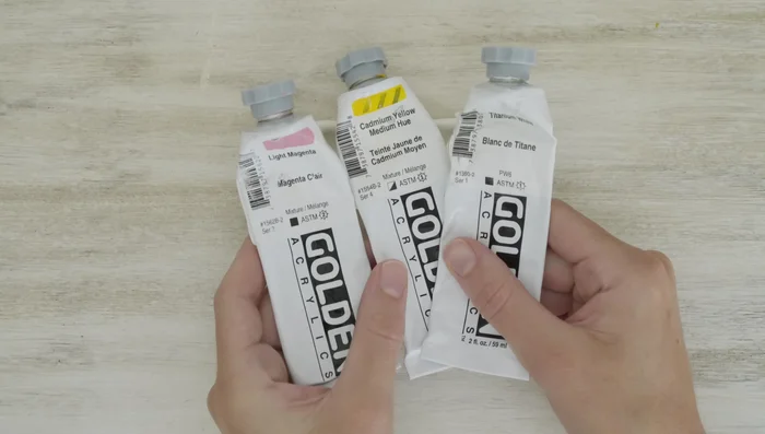 Add glitter: Apply glitter glue and loose glitter to the painted frames. Let it dry.