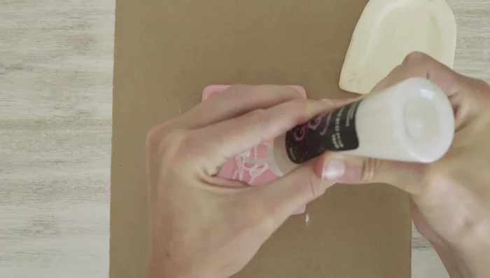 Add glitter: Apply glitter glue and loose glitter to the painted frames. Let it dry.