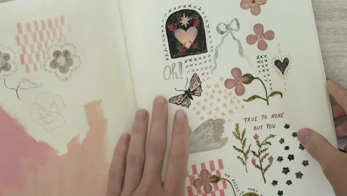 Illustrate the artwork: Use watercolors, colored pencils, ink, and acrylic paint to create your tiny artwork. Experiment with layering techniques and add text as desired. Let each layer dry before proceeding.