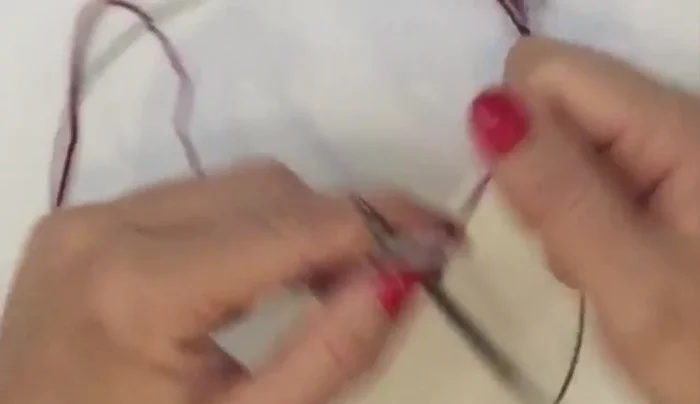 Begin the lace stitch pattern: Rows 3 and 4 are the same. Knit two garter stitches (salvage edge), then yarn over, knit one across the row until you reach the last two stitches and knit them.