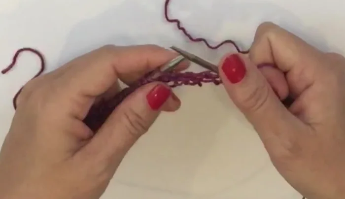 Row 6: Knit two garter stitches, then knit two together across the row. Knit the last two stitches.