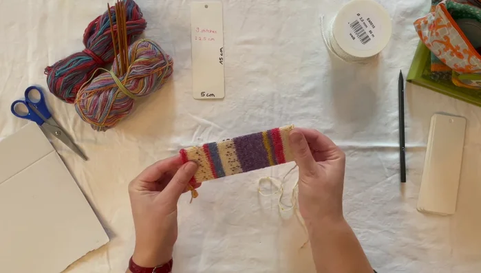 Thread ribbon through the pre-existing holes on the blank.