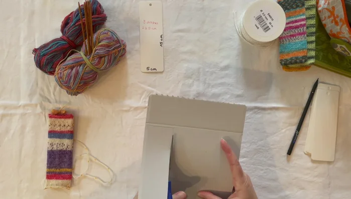 Punch a hole for the ribbon.