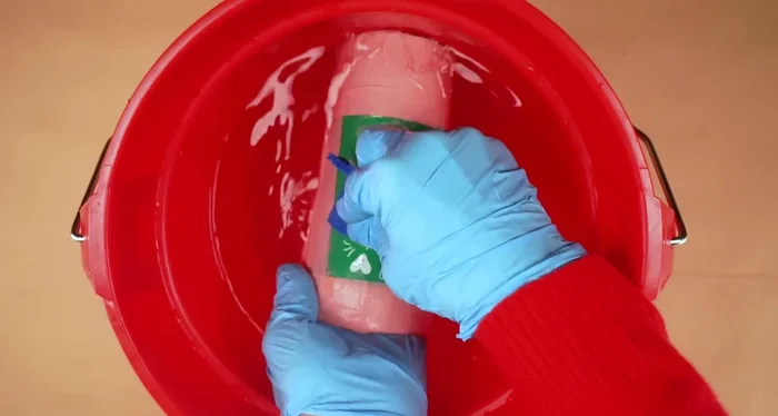 Scrub the design with a blue Scotch-Brite pad to remove the loosened powder coating. Rinse and let dry.