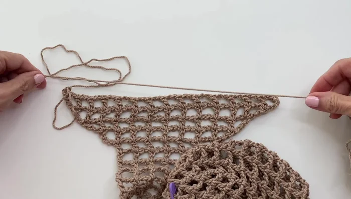 Attach Strap: Sew the strap to the bag using a whip stitch.