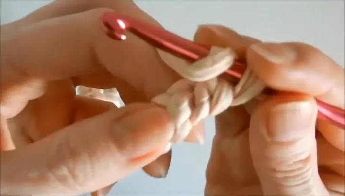 Finish the last row ensuring the final stitch is completely worked to maintain rug shape.