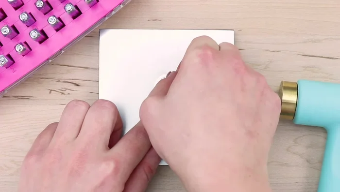 Repeat step 3 as needed for multiple impressions. Remove the stamp tape and stamp guide.