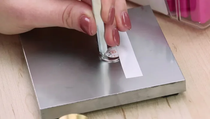 Repeat step 3 as needed for multiple impressions. Remove the stamp tape and stamp guide.