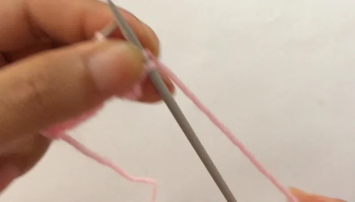 **Row 8:** Slip the first edge stitch purlwise, then repeat the pattern: purl two, knit one, purl two (until you reach the last stitch). Purl the last edge stitch.