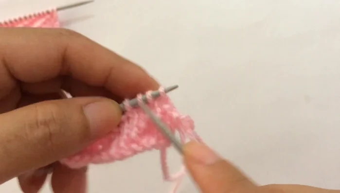 **Row 8:** Slip the first edge stitch purlwise, then repeat the pattern: purl two, knit one, purl two (until you reach the last stitch). Purl the last edge stitch.