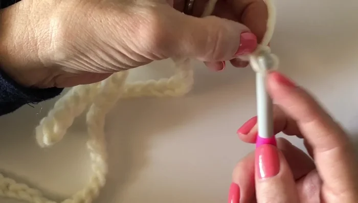 Work 13 stitches down the next side, skipping over two chain spaces.