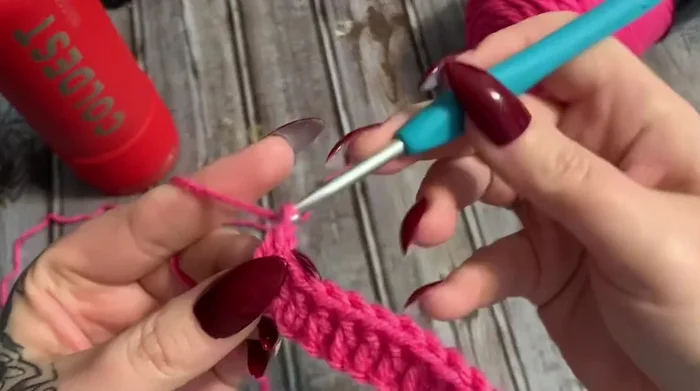 Begin the pattern: single crochet in the first stitch, front post double crochet in the next, single crochet in the next, repeat across, ending with a single crochet.