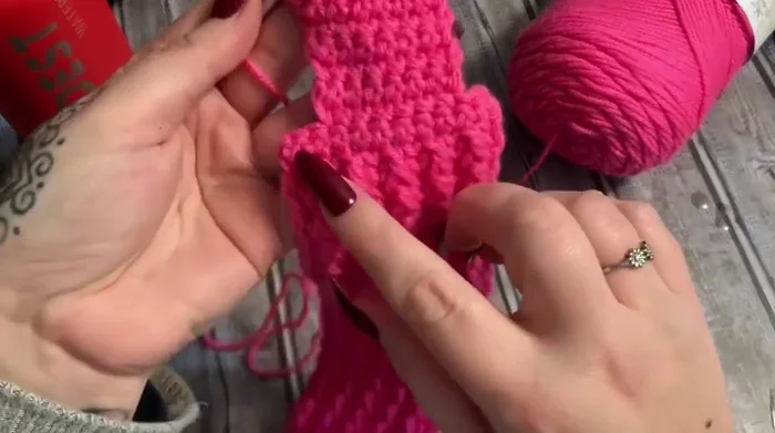Work a border around the entire piece: single crochet in each stitch except corners (3 single crochets in each corner). On the long sides, single crochet, skip a stitch, single crochet.
