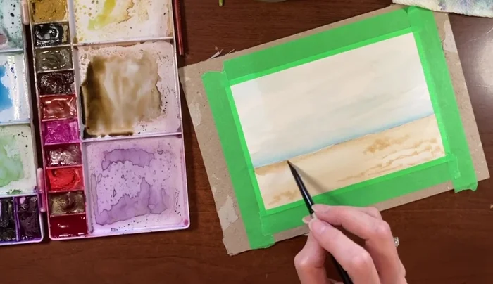 Add depth to the horizon line using a slightly darker wash of the sepia/burnt sienna mixture.