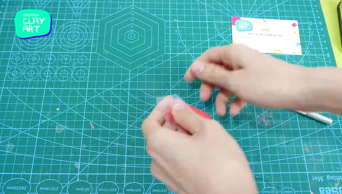 Prepare and condition red and black polymer clay using a pasta machine (for speed).