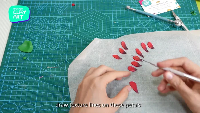 Use a needle tool to add texture to the petals.