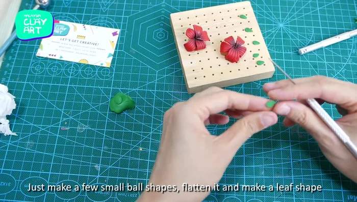 Create and attach small green leaves.