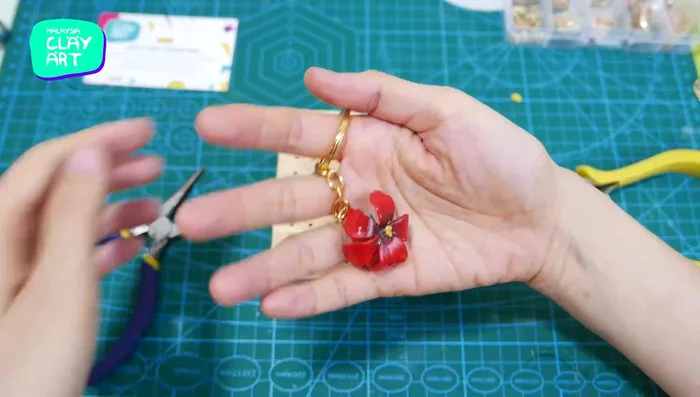 Attach the hibiscus to a keychain.