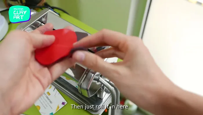Blend red and black clay using a simple folding and rolling technique.