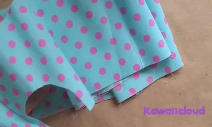 Make the second bow piece: cut another rectangular piece of fabric. Repeat steps 2-4 to create a second loop.