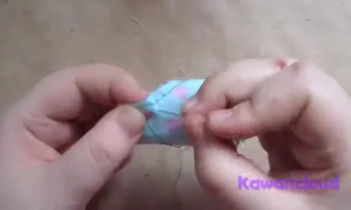 Close the opening with stitches to complete the first step (creating a loop).